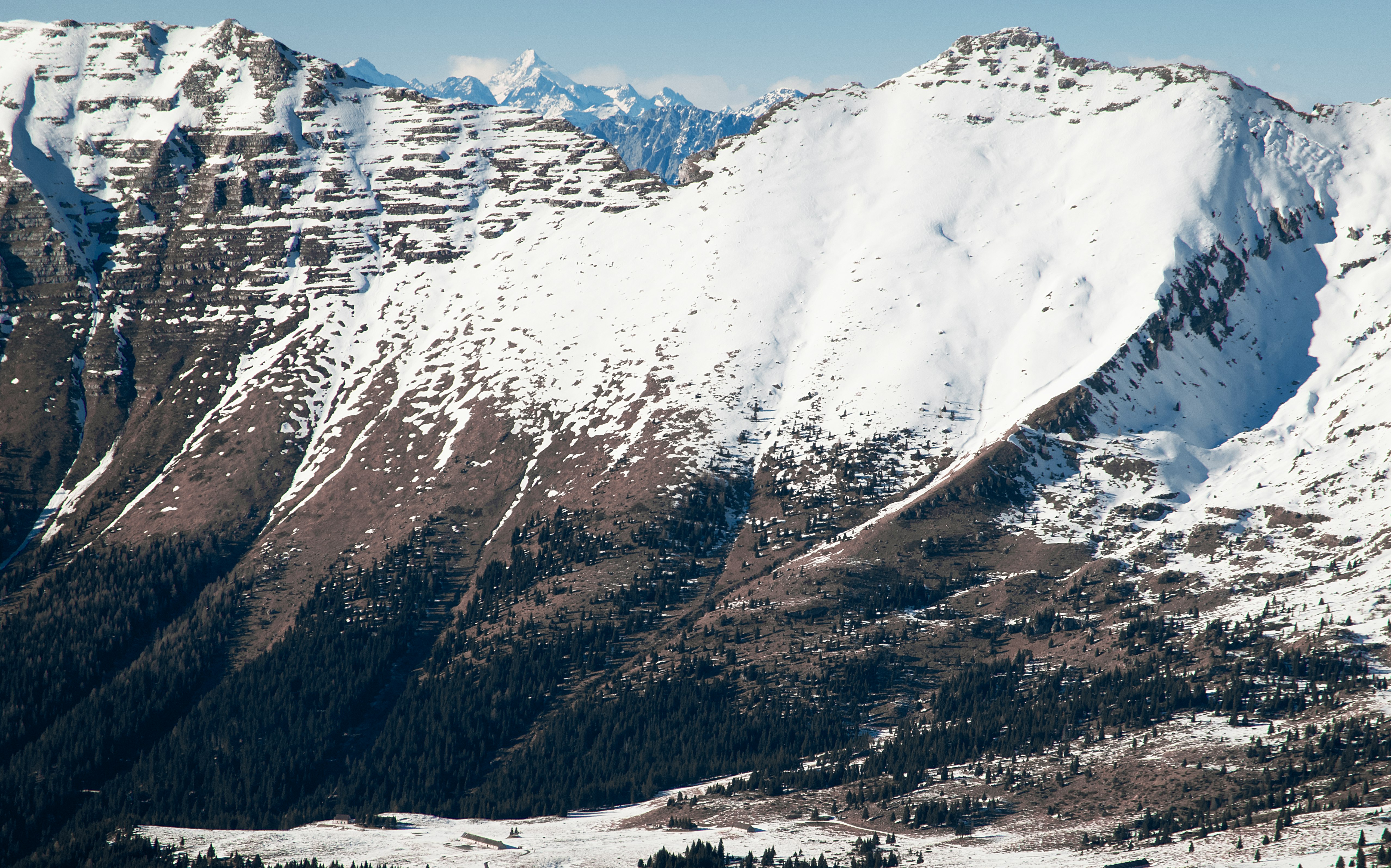 snow covered mountain during daytime